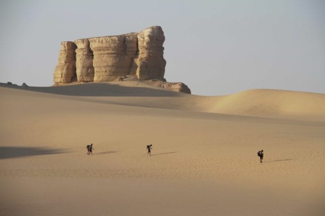 Runners/walkers in the desert